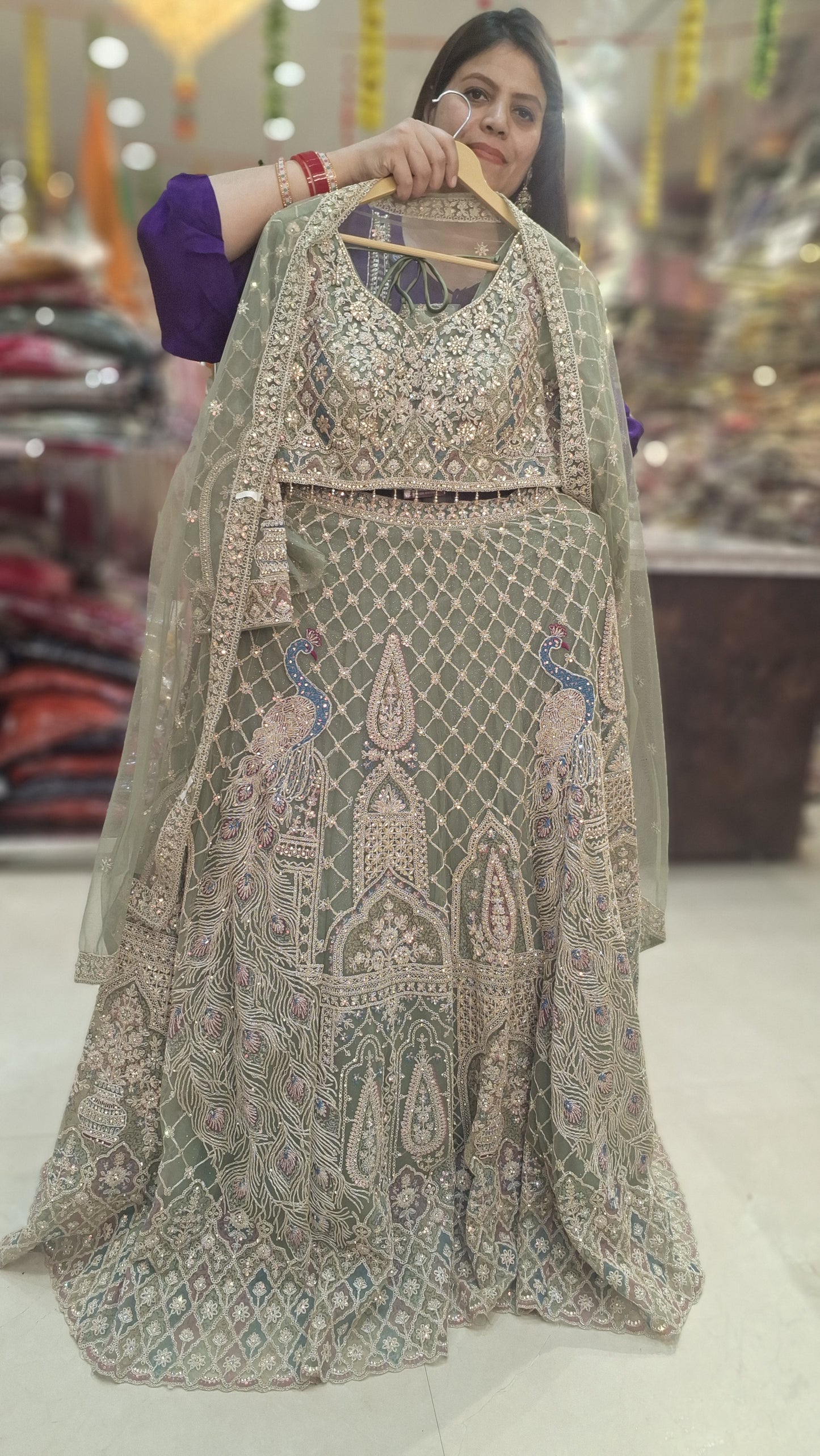 PISTA GREEN NITED THREAD AND MIRROR WORK HEAVY LEHNGA