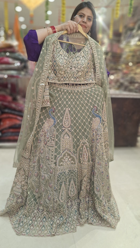 PISTA GREEN NITED THREAD AND MIRROR WORK HEAVY LEHNGA
